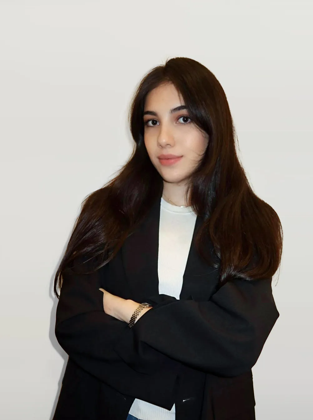 Anna Arakelyan, Project Coordinator at AP2 Real Estate, portrait in black blazer.