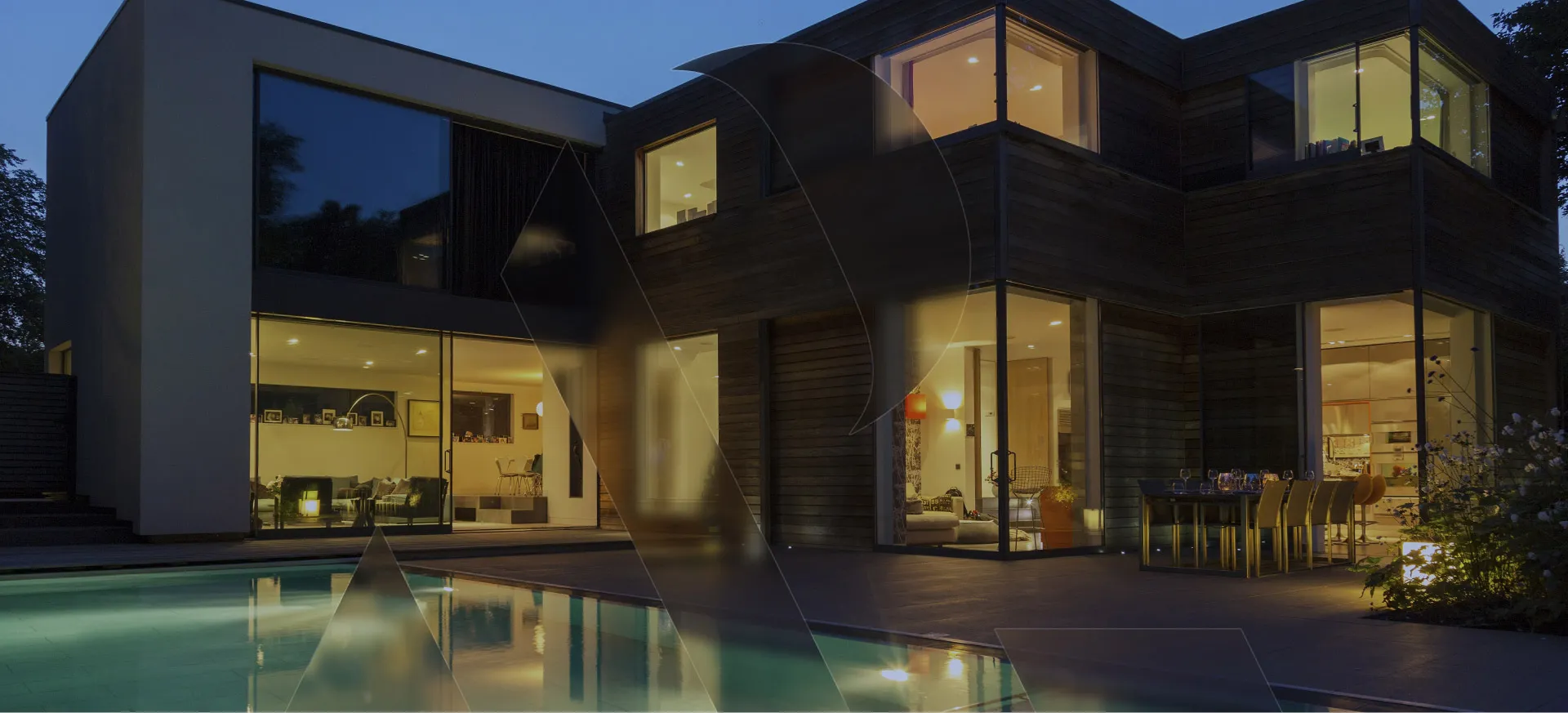 Luxury modern villa at night in Dubai with illuminated interior and pool — AP2 Real Estate property listing service