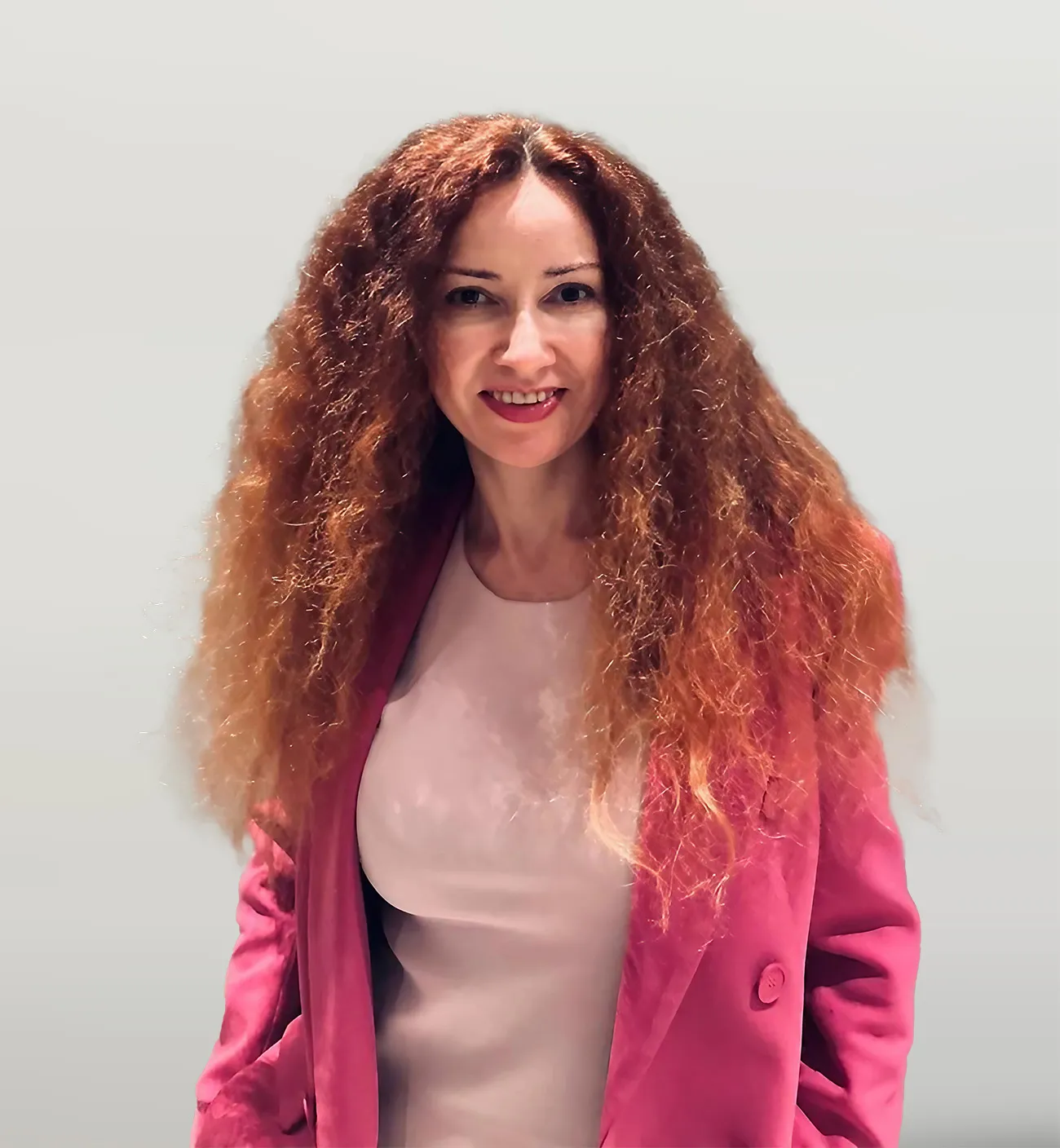 Viktoria Melnichuk, Senior Broker at AP2 Real Estate, portrait in a pink blazer.